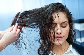 attractive woman in hair salon making new haircut