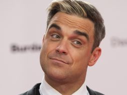 Robbie Williams arrives for the Bambi 2013 media awards in Berlin, Germany, Thursday, Nov. 14, 2013. (AP Photo/Gero Breloer)