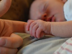 baby-holding-human-finger-225744 (1)