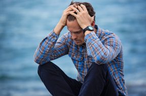 man-in-blue-and-brown-plaid-dress-shirt-touching-his-hair-897817 (1)