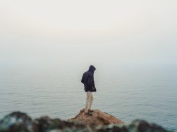 man-standing-on-sea-cliff-3464179