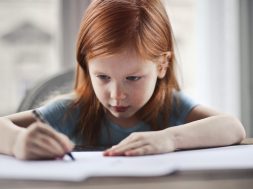 girl-writing-on-paper-1843358