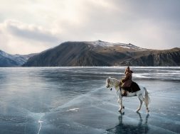 On the shooting of "Serko", a film reenacting the longest horse-ride ever done in the history of man, : 9000 Km in 200 days from the Amur River to St Petersburg, by a Cossack named Dimitri Petchkov and his horse Serko  in the winter of 1890. Siberia, Irkutsk District, Lake Baikal region, March 2005. Director: Joel Farges. Adaptation from the book by Jean-Louis Gouraud: Serko.
Dimitri Petchkov (Actor: Alexei) and horse Serko riding over frozen Lake Baikal.